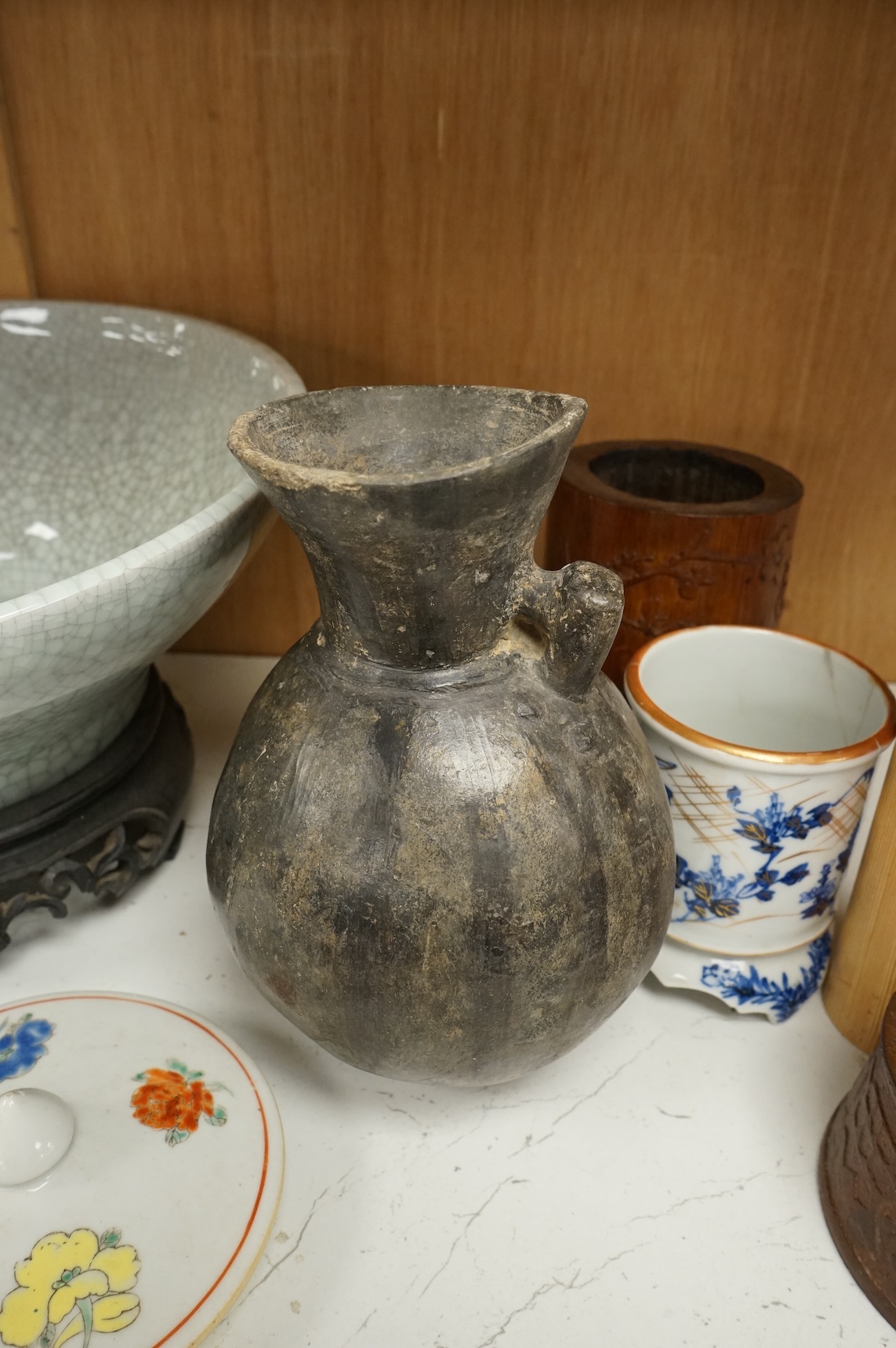 Oriental items to include a crackleglaze bowl on stand and a bamboo brush pot, together with two other vessels, largest 27cm in diameter